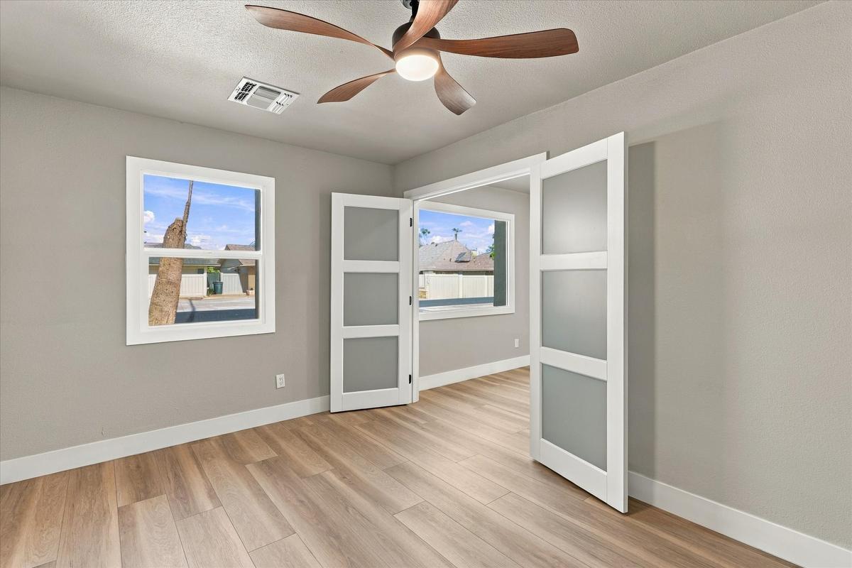 Office or fourth bedroom behind frosted glass doors